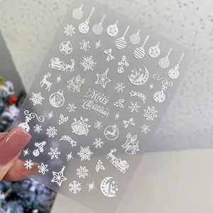 5D white matte embossed Christmas nail stickers featuring snowflakes and Santa Claus motifs