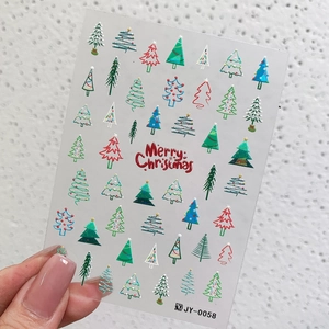 Colorful 3D Christmas tree nail art decals with matte gold accents for DIY manicure