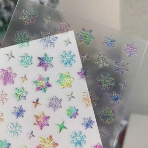 3D embossed snowflake nail art stickers with laser finish and holographic effect