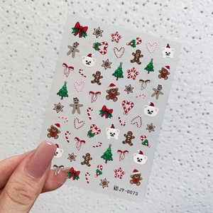 3D embossed Christmas nail art stickers featuring gingerbread man and holiday bear designs