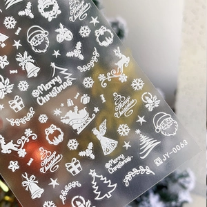3D embossed white Christmas nail decals with Santa, reindeer and snowflakes patterns