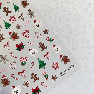 3D embossed Christmas nail art stickers featuring bears, gingerbread men, and festive trees