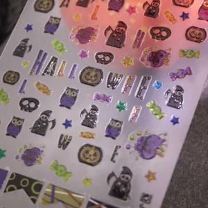 3D Halloween nail art stickers with purple owl, pumpkin and holographic relief effects
