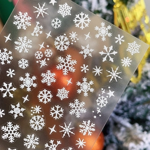 Embossed white snowflake nail art stickers for Christmas manicure with star patterns