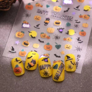 Halloween nail stickers with 3D pumpkin and bat designs on vibrant yellow faux nails