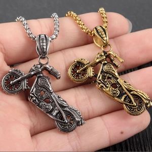 Retro motorcycle pendant necklace in silver and gold finish with industrial details