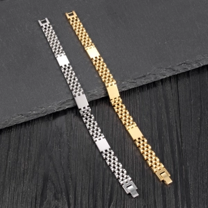 Detail of gold and silver stainless steel watch-style link bracelets on a textured background