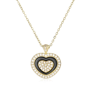 Macro shot of tiered heart pendant with black enamel and micro-pave crystals on a gold chain