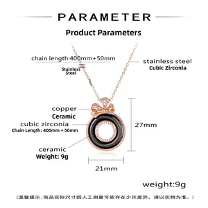 Detail view of bow ceramic necklace with cubic zirconia inlay and stainless steel chain