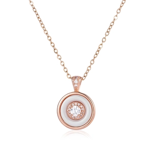 Detail of rose gold circle necklace with white ceramic and halo diamond pendant