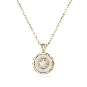 Detail of gold pendant necklace with white enamel ring and pavé set cubic zirconia