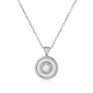 Detail shot of a layered circular pendant necklace with a sparkling round center stone
