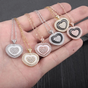 Fashion heart pendant necklaces set in gold and silver with sparkling cubic zirconia