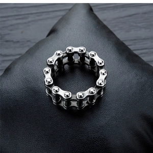 Punk style bicycle chain ring in vintage silver stainless steel on black leather base