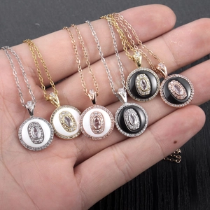 Set of six elegant circular pendant necklaces in gold, silver, and rose gold with crystals