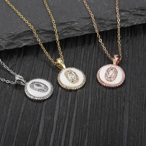 Minimalist round enamel pendant necklace with zircon crystals in gold, silver, and rose gold