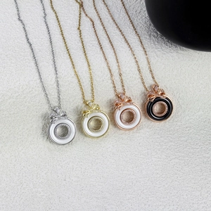 Elegant bow ceramic necklaces in gold and silver finish with sparkling zircon accents