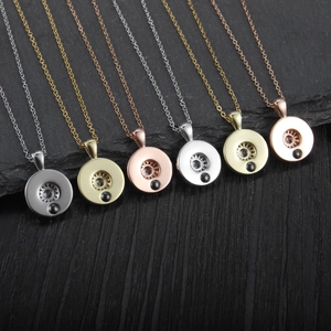 Minimalist circular projection pendant necklaces in silver, gold, and rose gold tones