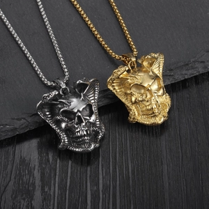 Gothic skull and serpent pendant necklaces in silver and gold stainless steel on stone