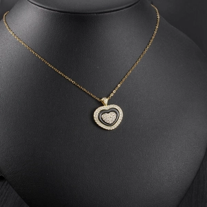 Detail of heart pendant necklace with black enamel and white crystal pave inlay