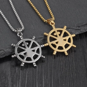 Detail of nautical rudder pendants in gold and silver finish with sturdy box chains