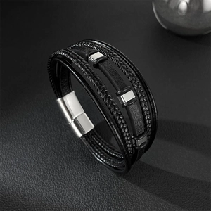 Detailed view of multilayer black leather braid with polished stainless steel magnetic clasp
