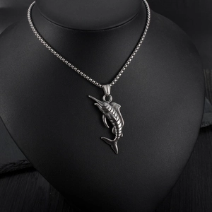 Detailed close-up of textured marlin fish pendant in vintage silver stainless steel finish