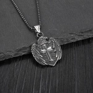 Vintage stainless steel eagle cross shield pendant necklace on black slate display