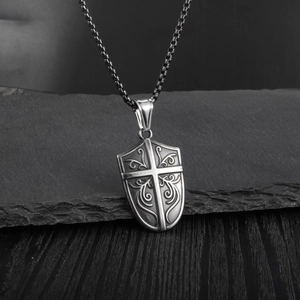 Retro shield necklace for men featuring an engraved cross and vintage scroll patterns