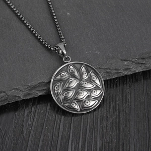 Retro stainless steel round necklace with evil eye pattern on dark stone background