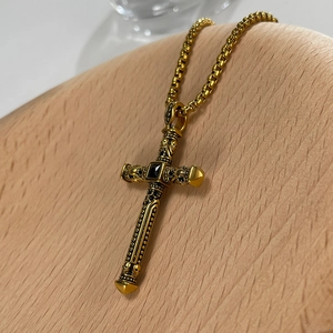 Retro gold stainless steel cross necklace with skull relief and black square gemstone