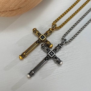 Gothic cross necklace with black stone and skull engravings in gold and silver