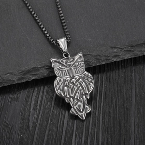 Vintage silver owl pendant necklace for men with black box chain on stone background