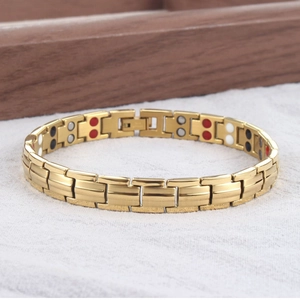 Close-up of gold titanium magnetic therapy bracelet with multi-color functional stones
