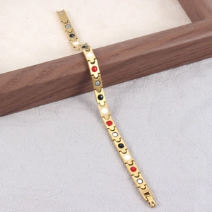 Magnetisches Titanstahl-Armband in Gold mit tropfenförmigen Gliedern für Wellness
