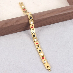 Bracelet à maillons flèches en acier titane doré avec inserts magnétiques colorés