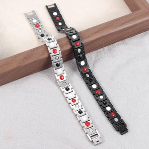 Magnetic therapy bracelets in black and silver steel with multi-color wellness magnets