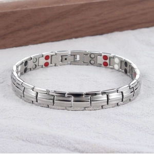 Detailed view of dual-row magnetic therapy beads on silver titanium steel bracelet