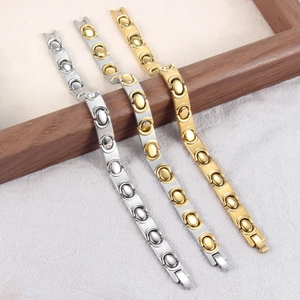 Modieuze zakelijke magnetische armband met ovale schakels in goud, zilver en tweekleurig