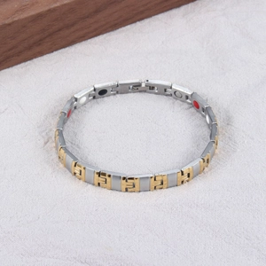 Detail view of two-tone magnetic stainless steel therapy bracelet with healing stones