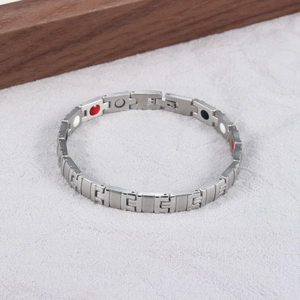 Detailed close-up of titanium steel energy bracelet with magnetic therapy stones
