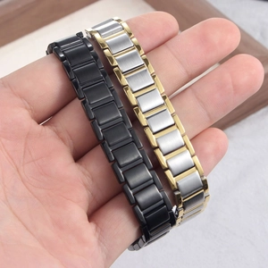 Detailed macro view of magnetic steel bracelet showing flexible link structure and finish