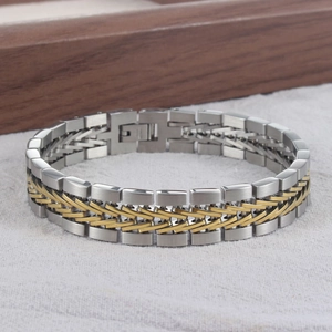 Detail of male vintage woven titanium steel bracelet with gold and silver link texture