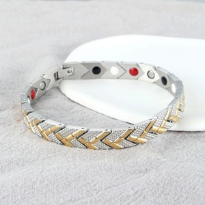 Two-tone magnetic therapy bracelet with V-shaped links and colorful health stones