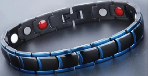 Macro shot of men's magnetic therapy bracelet with blue accents and inlay stones