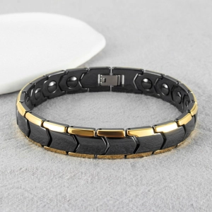 Black and gold magnetic therapy bracelet with arrow-shaped links and polished finish