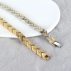 Arrow-link magnetic bracelets in gold and two-tone silver finishes with knurled texture