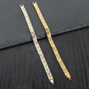 Close-up of gold and silver magnetic arrow bracelets with woven texture and safety clasp
