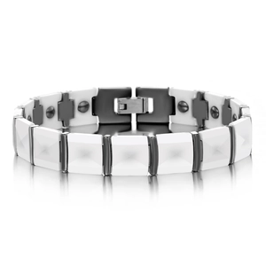 Macro detail of white ceramic magnetic bracelet with grey metal links and folding clasp