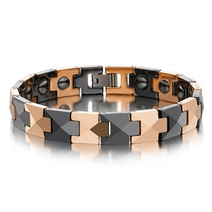 Detail of rose gold and black ceramic magnetic therapy bracelet with X-shaped links